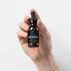 NeuroSelf hair oil bottle for scalp health and hair growth, with dropper applicator and natural ingredients on a white background.